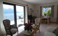 Bild 6: Wohnzimmer mit Aussicht auf Ascona, See und Berge